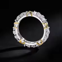 A dazzling gold and silver color-blocked cross ring
