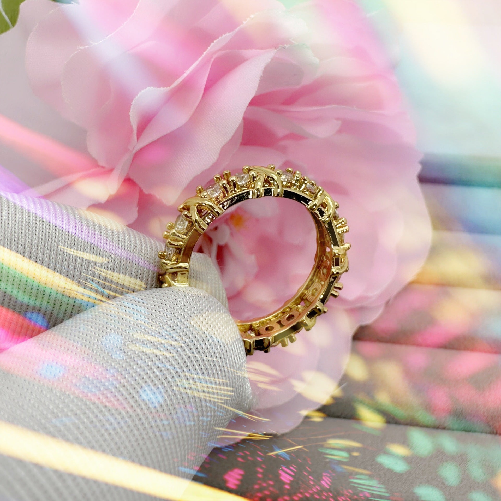 A dazzling gold and silver color-blocked cross ring